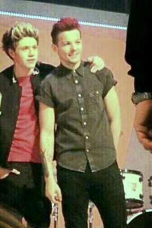Louis Tomlinson dyes his hair red for Comic Relief.