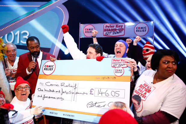 Peter Kay and fundraisers celebrate £146.05 raised from the comedian's 'Sit Down' challenge