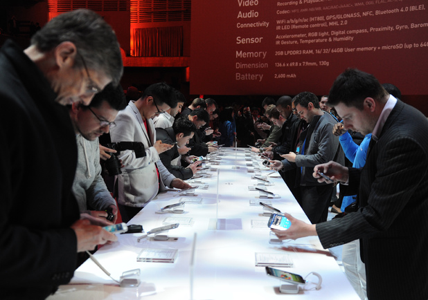 People eagerly check out the Galaxy S4 after its launch at Radio City Music Hall