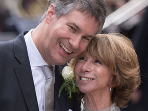 Newly weds Helen Worth and Trevor Dawson step out of the church.