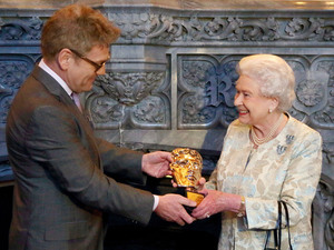Queen Elizabeth II receives an honorary Bafta from Kenneth Branagh in recognition of a lifetime's support of British Film and Television - and for being 'the most memorable Bond girl yet' at Windsor Castle