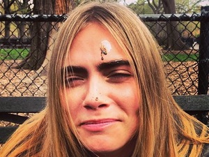 Cara Delevingne with bird poo on her face