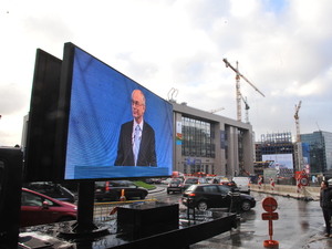 EU Council president Herman Van Rompuy appears on a giant screen