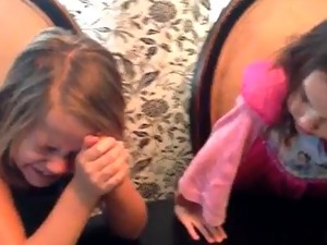 Girls react to new of twins from cake
