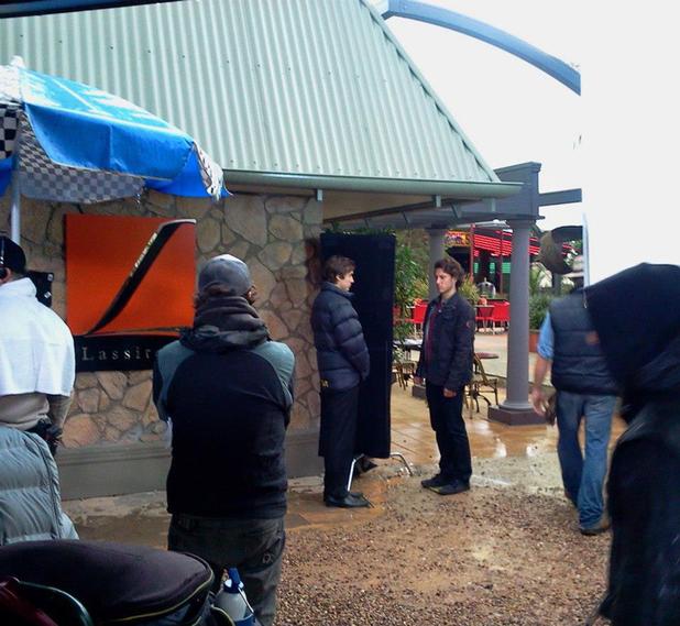 Taylor Glockner and Aaron Jakubenko film a scene outside Lassiter's