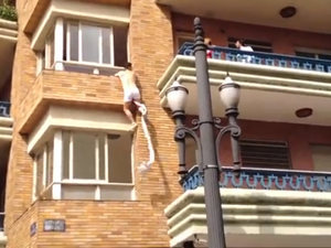 Half-naked Brazilian climbs out of lover's window