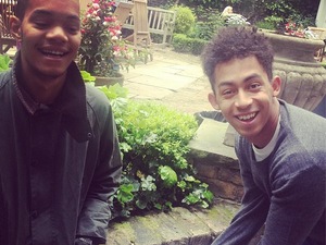 Rizzle Kicks poses in front of Abbey Road sign.