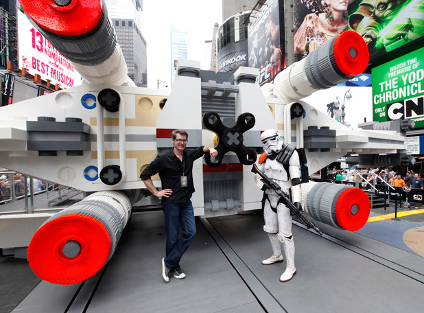Thousands gather in New York City's Times Square to watch the unveiling of the world's largest LEGO Model, a 1:1 replica of the LEGO Star Wars X-wing Starfighter that took 32 Model Builders, 5.3 million LEGO bricks and over 17,000 hours to complete, Thursday May 23, 2013.