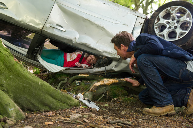 Cameron talks to a trapped Gennie.