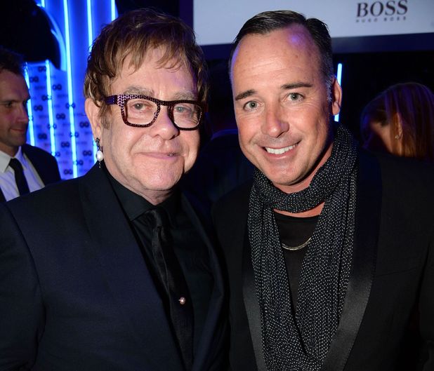 Sir Elton John and David Furnish arriving at the GQ Men of the Year Awards held at the Royal Opera House 