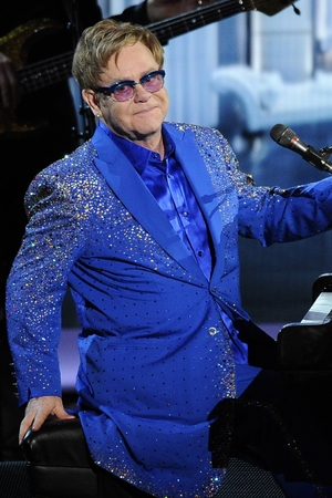 Elton John performs 'Home Again' at the 65th Primetime Emmy Awards at Nokia Theatre on Sunday Sept. 22, 2013, in Los Angeles.
