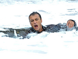 Jai plunges into the frozen waters.