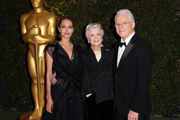 Angela Lansbury (C), Angelina Jolie (L) and Steve Martin (R) arrive for the 2013 Governors Awards, presented by the American Academy of Motion Picture Arts and Sciences (AMPAS), at the Grand Ballroom of the Hollywood and Highland Center in Hollywood, California, November 16, 2013