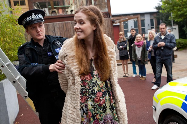 Chloe is led away.