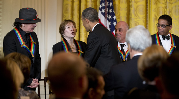 President Obama congratulates Shirley MacLaine at the Kennedy Center Honors in the East Room of the White House