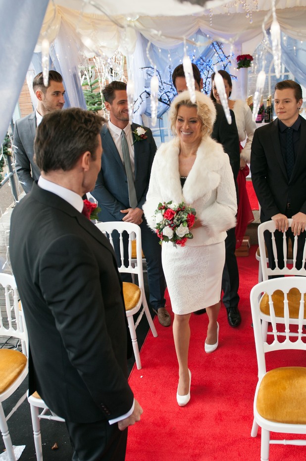 Sandy walks down the aisle