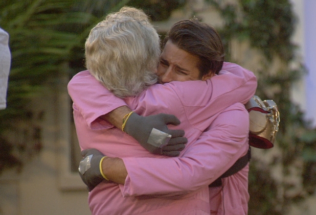 Lionel and Ollie hug each other