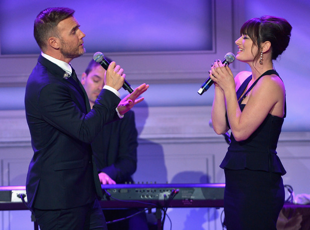 Gary Barlow and Laura Michelle Kelly perform onstage at The Weinstein Company's Academy Award