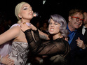 Ex-enemies poke fun at their feud at Elton John's Academy Awards viewing party.
