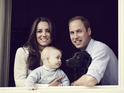 The young royal family are pictured at a window in Kensington Palace.