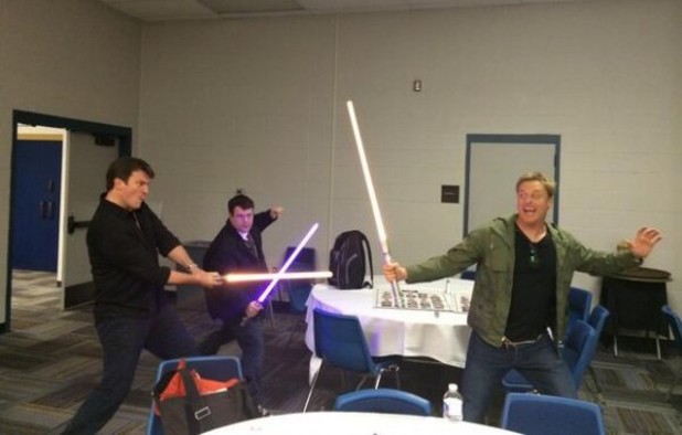 Sean Astin, Alan Tudyk, Nathan Fillion in lightsaber fight 