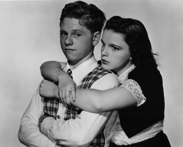 Mickey Rooney is hugged by Judy Garland in a scene from the film 'Love Finds Andy Hardy', 1938.