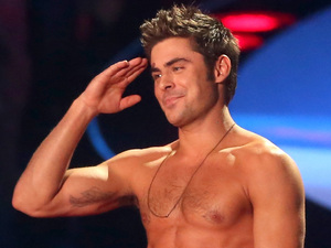 Rita Ora rips Zac Efron's shirt off during MTV Movie Awards