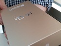 Photograph of the Android smartphone's golden packaging appears online.