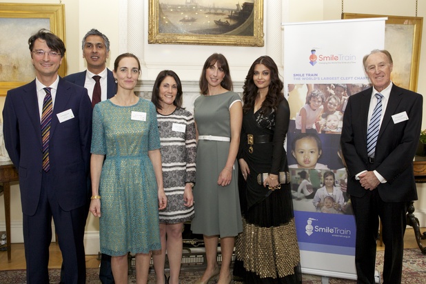 Aishwarya Rai Bachchan at the Smile Train reception at Downing Street alongside Edoardo Monopoli, Amerjit Chohan, Vera Pellegrin, Susannah Schaefer, Samantha Cameron & John Dunningham