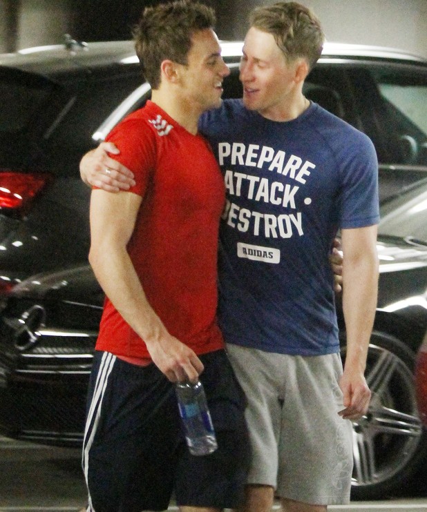 Tom Daley and Dustin Lance Black share a kiss after a gym session together