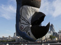 The huge model was flown into the capital to celebrate Monty Python's live shows.