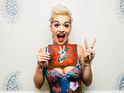 will.i.am says he's "happy" that Rita Ora is filling Kylie Minogue's red chair.