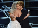 The singer is hugged and congratulated after performance by original star Julie Andrews.