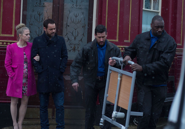 Mick and Linda watch as Stan's bed is taken away.