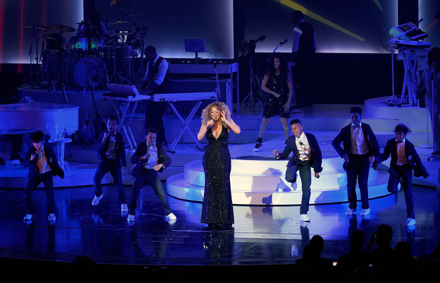 Mariah Carey performs with dancers during the launch of her residency 'MARIAH #1 TO INFINITY' at The Colosseum at Caesars Palace on May 6, 2015 in Las Vegas, Nevada.
