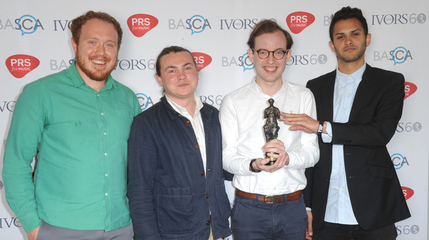 Bombay Bicycle Club: L-R: Jamie McColl; Ed Nash; Jack Steadham; Suren de Saram with the award for Best Album at the Ivor Novello Awards at The Grosvenor House Hotel on May 21, 2015 in London, England