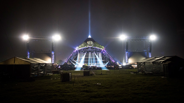 Workers put the finishing touches to the Pyramid Stage at Glastonbury Festival 2015