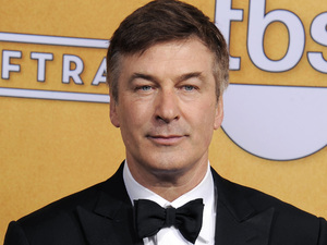 Alec Baldwin poses backstage with the award for best make actor in a comedy series in the press room at the 19th Annual Screen Actors Guild (SAG) Awards
