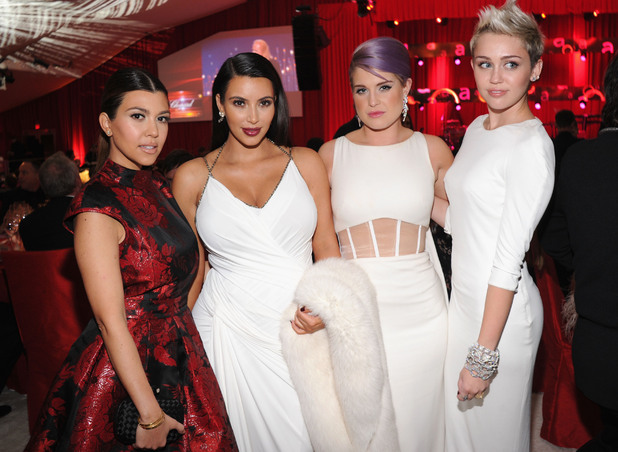 WEST HOLLYWOOD, CA - FEBRUARY 24: (L-R) TV Personalities Kourtney Kardashian, Kim Kardashian and Kelly Osbourne and actress/singer Miley Cyrus attend the 21st Annual Elton John AIDS Foundation Academy Awards Viewing Party at Pacific Design Center on February 24, 2013 in West Hollywood, California. (Photo by Jamie McCarthy/Getty Images for EJAF)