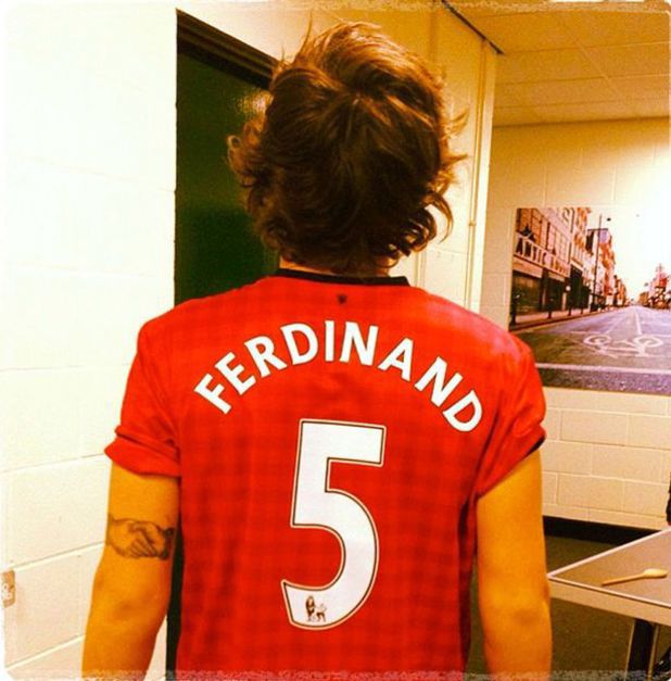 Harry Styles wears Rio Ferdinand's Manchester United shirt.