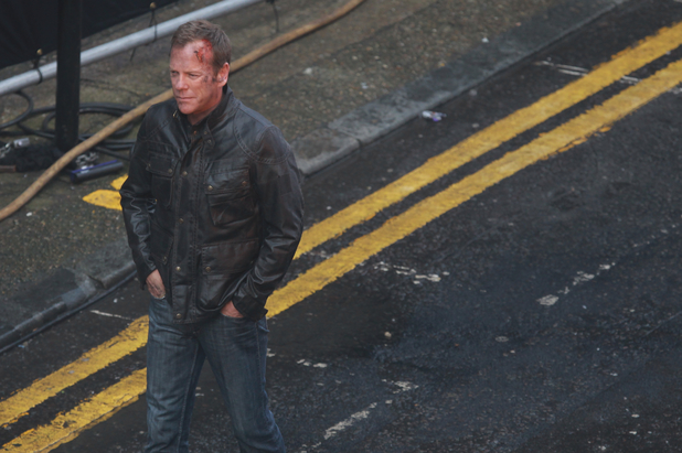 Kiefer Sutherland on the set of hit U.S. television thriller '24'. In one particular scene, Kiefer carries a handgun and a London taxi explodes in a busy street.